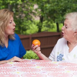 Woman works on speech therapy