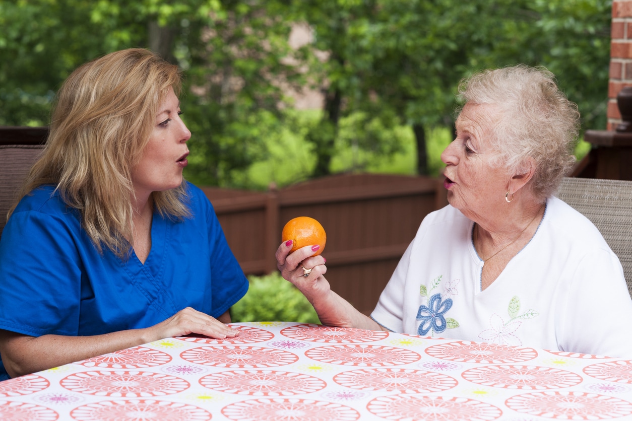 Woman works on speech therapy