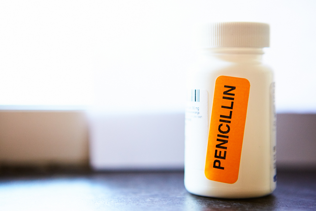 Pharmacist has stuck a bright orange sticker on a container of antibiotics to draw attention to the fact that they contain penicillin, to which some people are allergic.